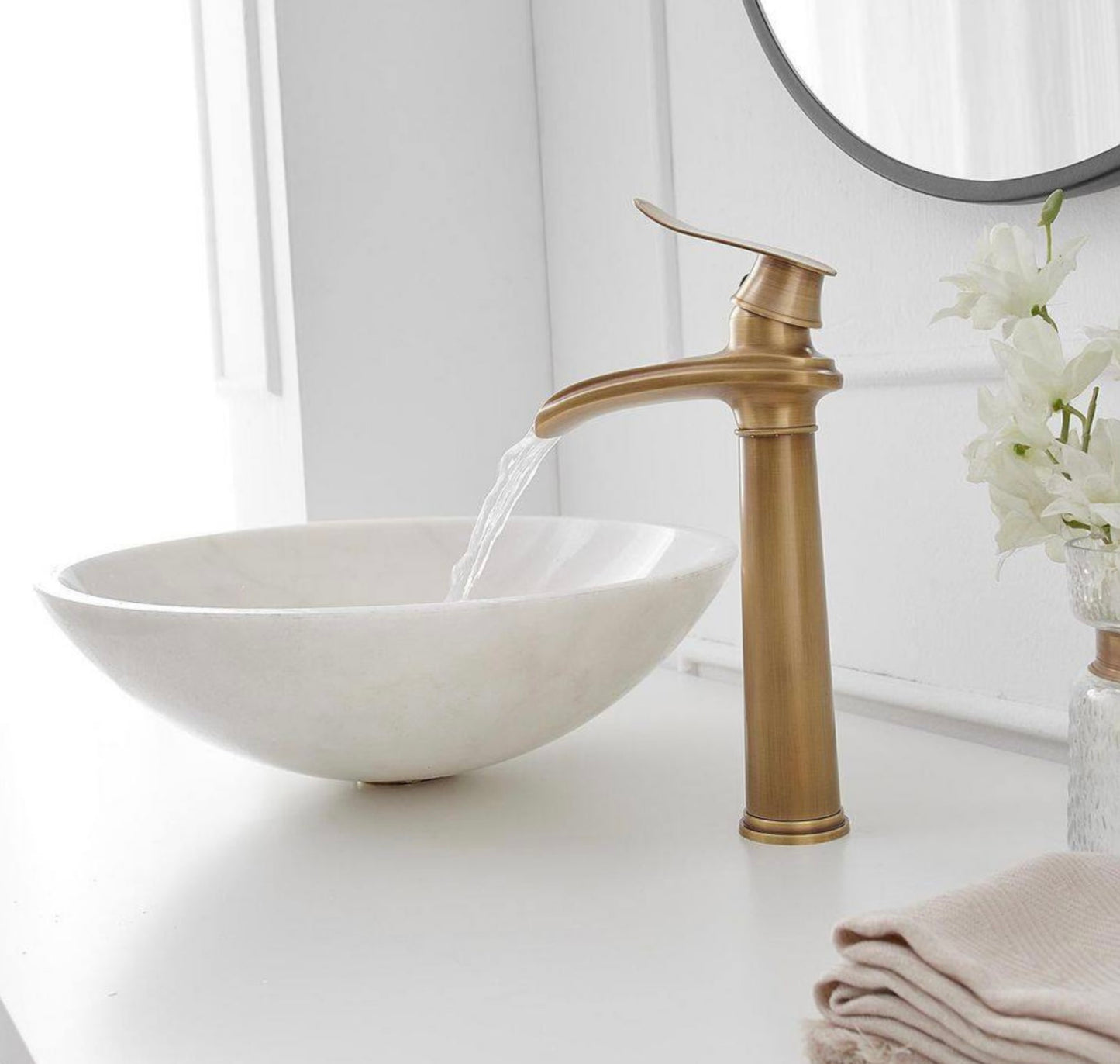 Waterfall vessel sink faucet in antique brass